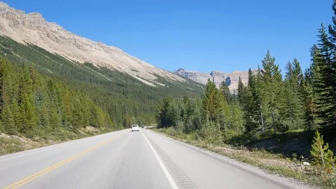 View from the moving car while driving along the local natural way in canada Stock Footage 120271689