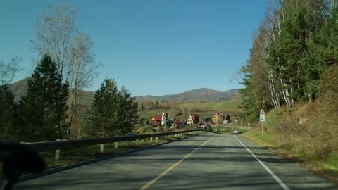 View from moving car while driving on mountain road among pine trees. Stock Footage 310090151