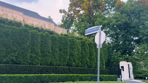 A view from a moving car window along a public road. Stock Footage 343676317