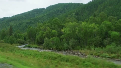 View from moving car window. Picturesque roadside. Видео 206710117