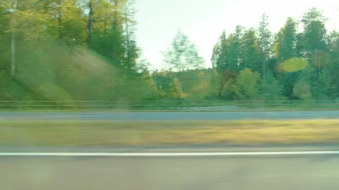 View from moving car window showing freight transport and traffic on highway Stock Footage 347579798