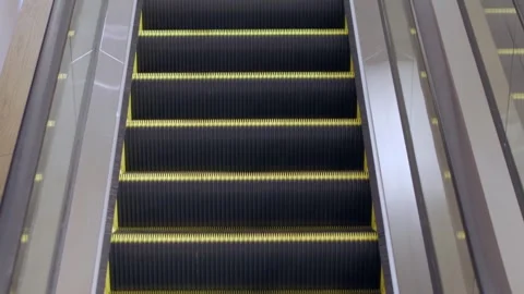 View of moving up escalator in department store shopping mall subway transp.. Stockbeeldmateriaal 267018705