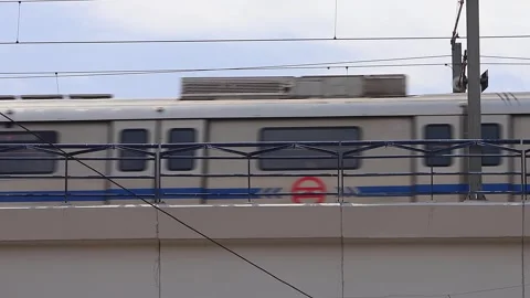 View of moving metro train near RK Ashram Marg station in New Delhi. Stock Footage 285346881