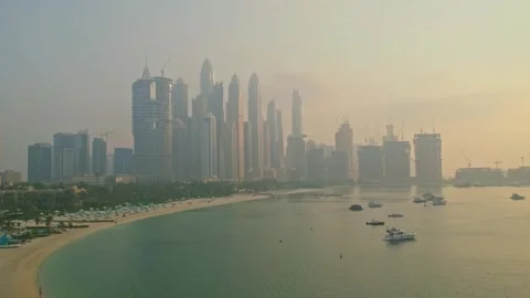 View from a moving monorail train window of the spectacular Dubai Marina sk.. Stock-Footage 348284580
