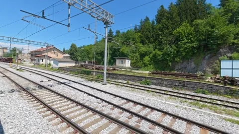 View from a moving passenger train travelling through Slovenia 스톡 동영상 339805964
