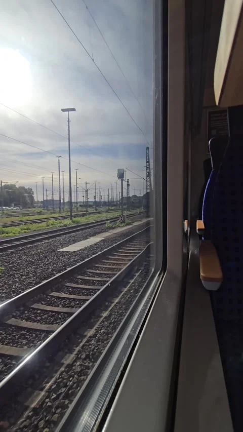 View from a moving passenger train window showcasing railway tracks, signal.. Stock Footage 341900355