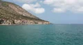 View from moving ship at Cyprus island with small mountains in Mediterranean sea HD Footage