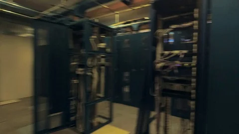 View moving through the rows of racks with communication servers, wires and leds Stock Footage 101895738