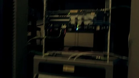 View moving through the rows of racks with communication servers, wires and leds Video stock 101896169
