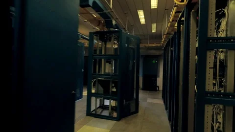 View moving through the rows of racks with communication servers Stock Footage 101896461