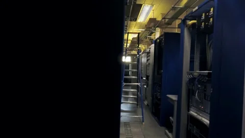 View moving through the rows of racks with communication servers, wires and leds Stock Footage 102238430