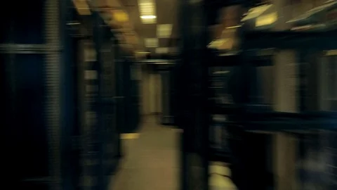 View moving through the rows of racks with communication servers, wires and leds Video stock 102238439