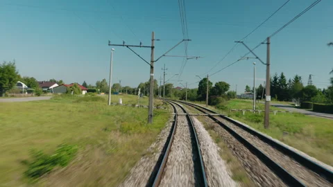 View from a Moving Train on Curving Electrified Railway Tracks Stock Footage 346763993