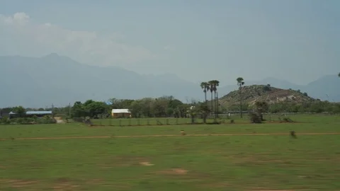 A view from the moving train in India south, day time Stock Footage 83335722