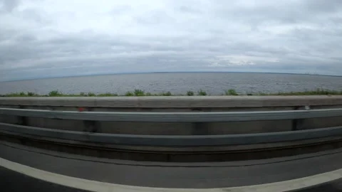 View from moving vehicles to the road and the sea. Stock Footage 163976261