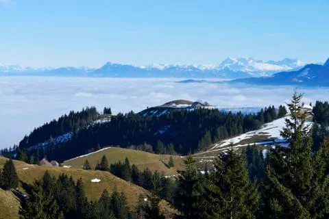 View from Mt Napf across a sea of ​​fog in the Swiss Alps or Central Alps Stock Photos