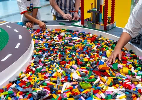 View on multi color plastic bricks at the table. Stock Photos