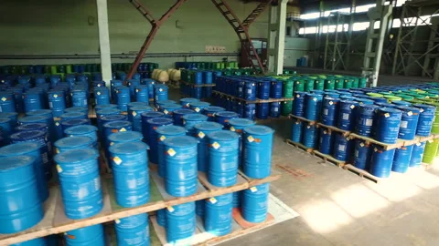 View of multi-colored barrels of radioactive substances. Warehouse of hazardous Stock Footage 98083410