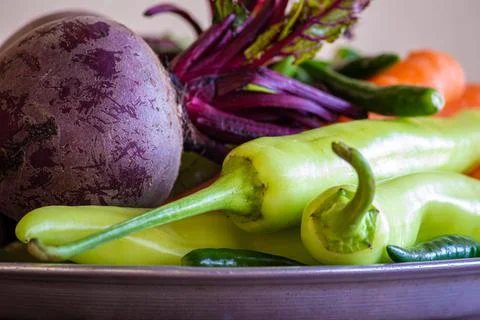 View of multi-colored vegetables (carrot, chili pepper, beetroot) in a bowl Stock Photos