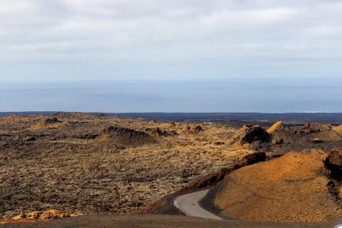 View at multi colored volcanic landscape in Timanfaya Nationalpark Stock Photos