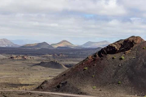 View at multi colored volcanic landscape in Timanfaya Nationalpark Stock Photos