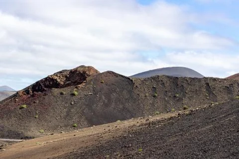 View at multi colored volcanic landscape in Timanfaya Nationalpark Stock Photos