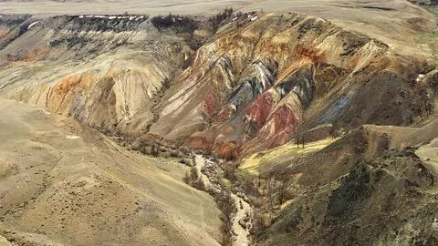 View of multicolored mountain slopes formed by centuries of natural erosion Stock Photos