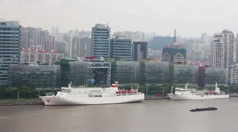 View of multiple barges sailing along river through Shanghai. Shanghai,  China Stock Footage 39036762