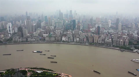 View of multiple barges sailing along river through Shanghai. Shanghai, China Stock Footage 39248629