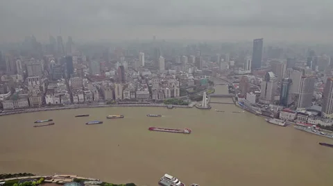View of multiple barges sailing along river through Shanghai. Shanghai,  China Stock Footage 39250506