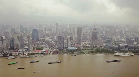 View of multiple barges sailing along river through Shanghai. Shanghai,  China Stock Footage 39254110