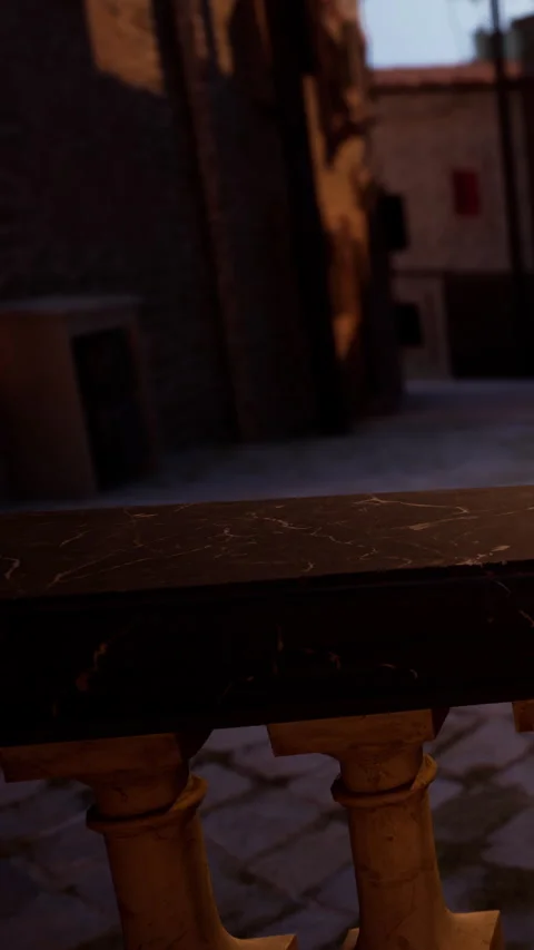 View of a narrow street with a focus on a marble top table in the foreground Stock Footage 340889210