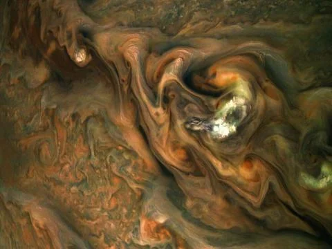 This view from NASA s Juno spacecraft captures colorful, intricate pattern... Stock Photos