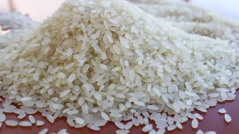 View of natural rice heap on the table Stock Footage 142164659