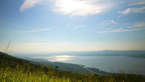 View nature of hill and river on blue sky on sunny background 動画素材 219812889