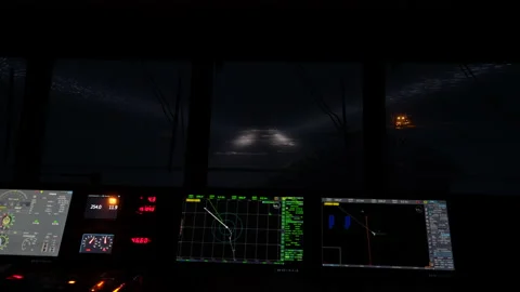 View from navigation bridge. Vessel at night with searchlights. Snow and ice Stock Footage 236659912