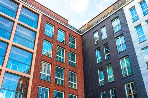View of a new residential rectangular modern inside corner red and black bric 스톡 사진