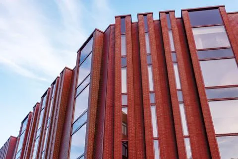 View of a new residential rectangular modern red brick house with elongated w Stock-Fotos