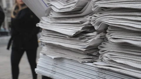 A view of newspapers and magazines piled up for the public. Stock Footage 125298542