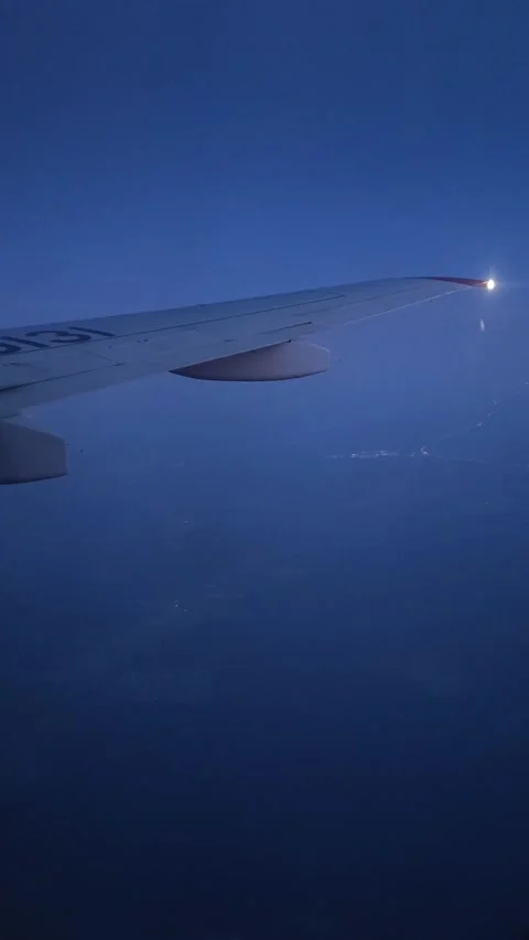 A view of the night city from the airplane window. Night city lights. Stock-Footage 324935361