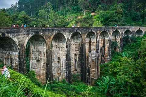 View to the nine arch stone bridge in green jungle Stock Photos