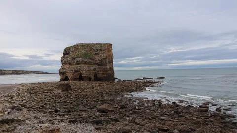 View of the North Sea Shore With a Large Rock Stock Footage 246942548