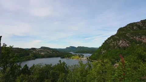 View of a Norwegian landscape featuring a lake surrounded by mountains and .. Stock Footage 340212067