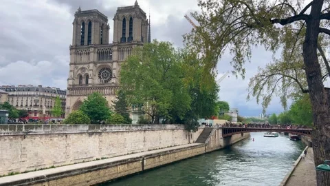 View of Notre Dame Cathedral, Pont au Double bridge over the Seine river. Stock Footage 311936731