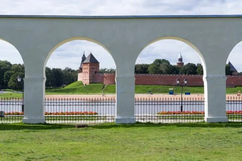 View of the Novgorod Kremlin through the arcade of the Yaroslavl yard on a su Stock Photos