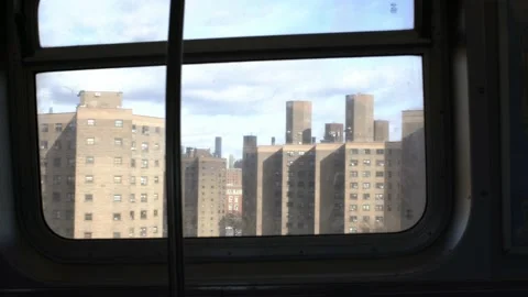 View from NYC Subway. Looking out of window at passing Buildings in NYC Stock Footage 199987911