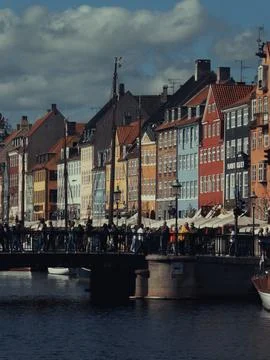 View of Nyhavn Canal and bridge crowded with people Stock Photos