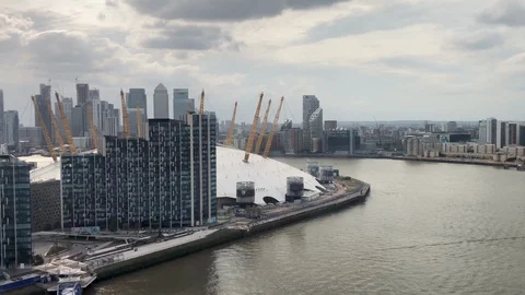 View of the O2 Arena behind new apartsments from the Emirates Air Line Stock Footage 113275941