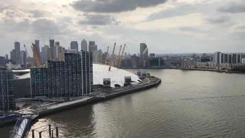 View of the O2 Arena behind new apartsments from the Emirates Air Line Stock Footage 113616374
