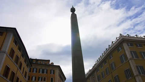 View of the obelisk standing on Piazza Montecitorio. The lights of a sun. Stock Footage 124415535